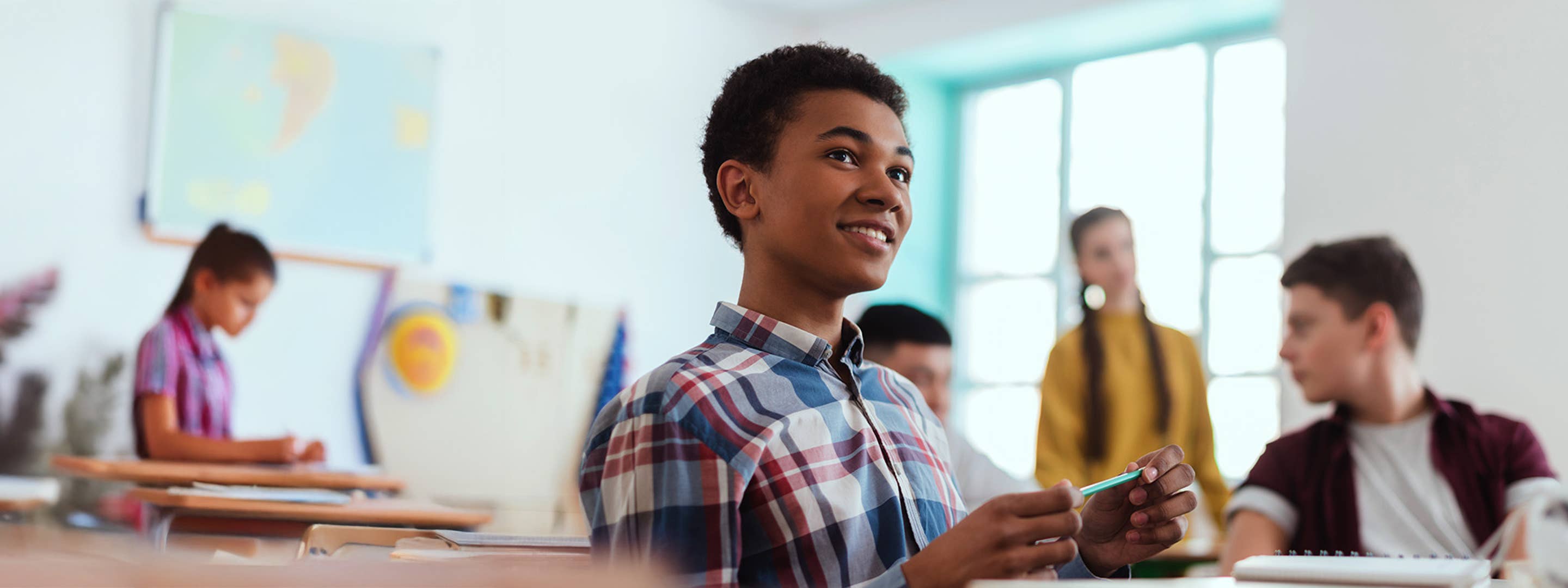 Young student smiling in a classroom