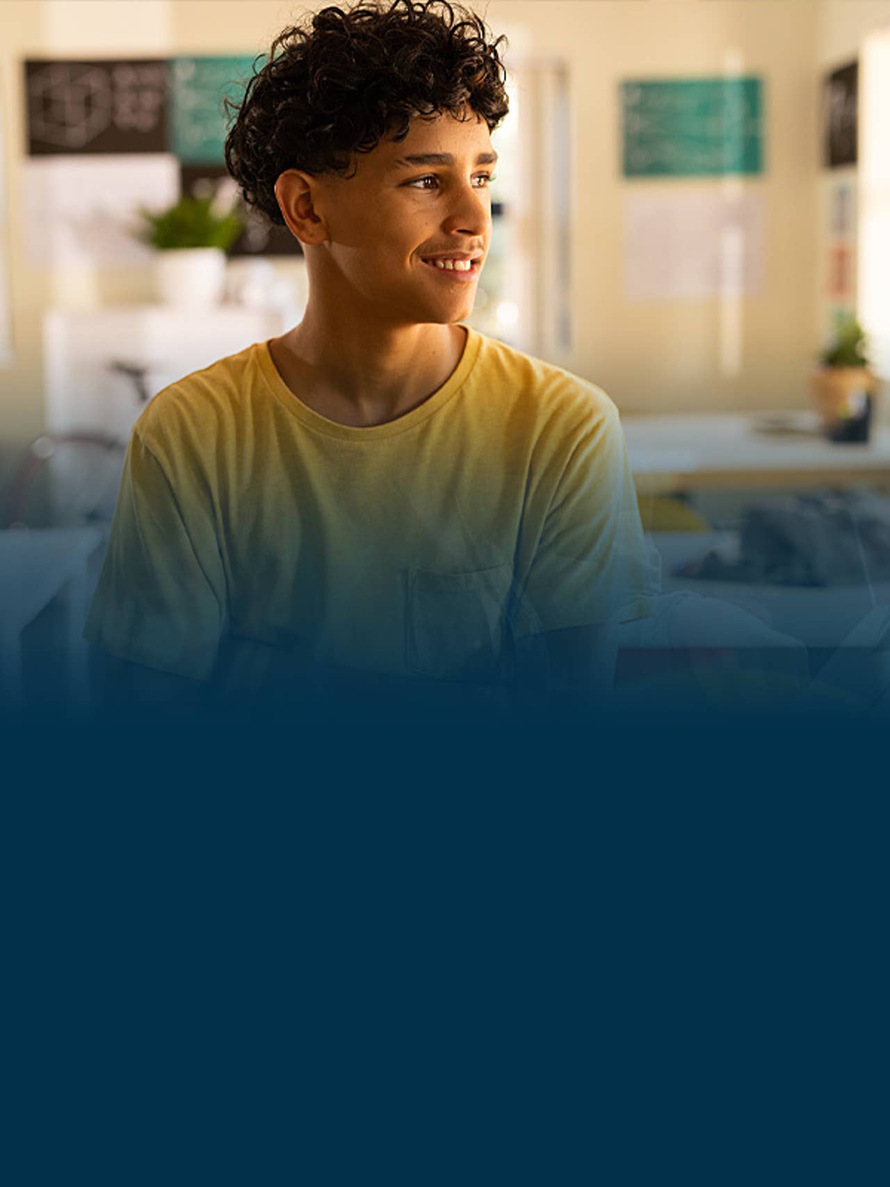 Young man smiling in a classrom