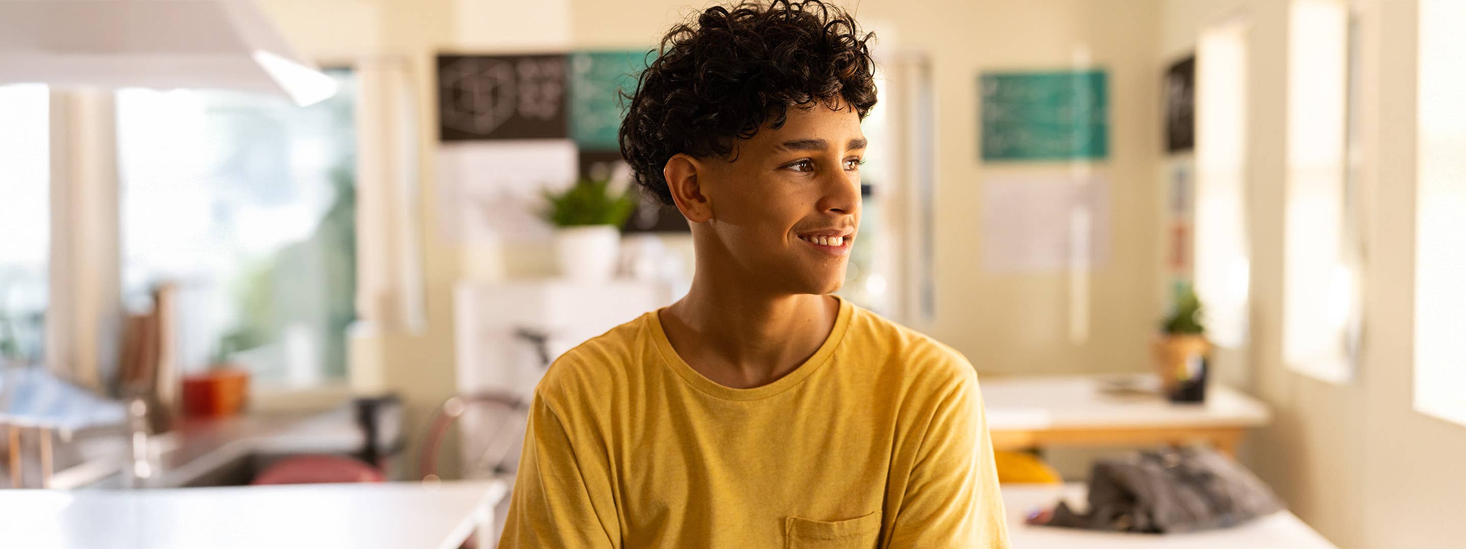 Young man smiling in a classrom