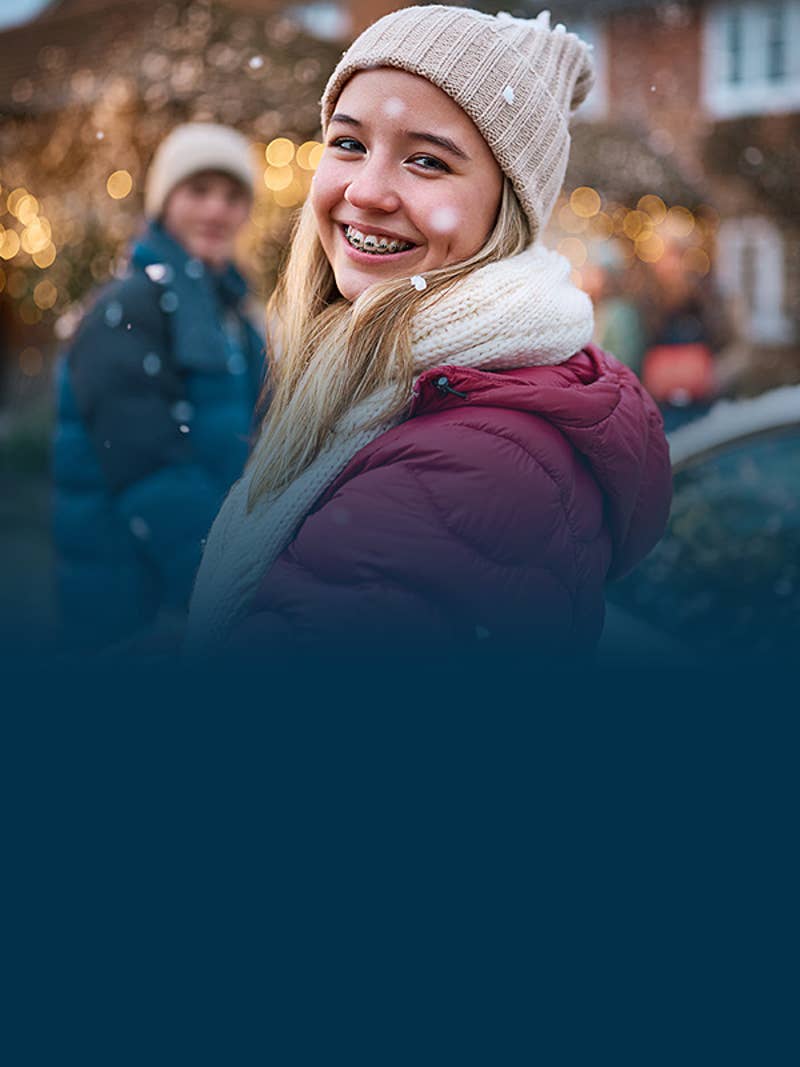 Teen girl smiling with winter wear
