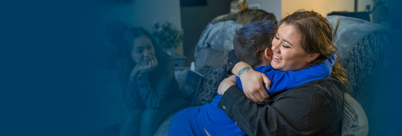 Mother hugging son