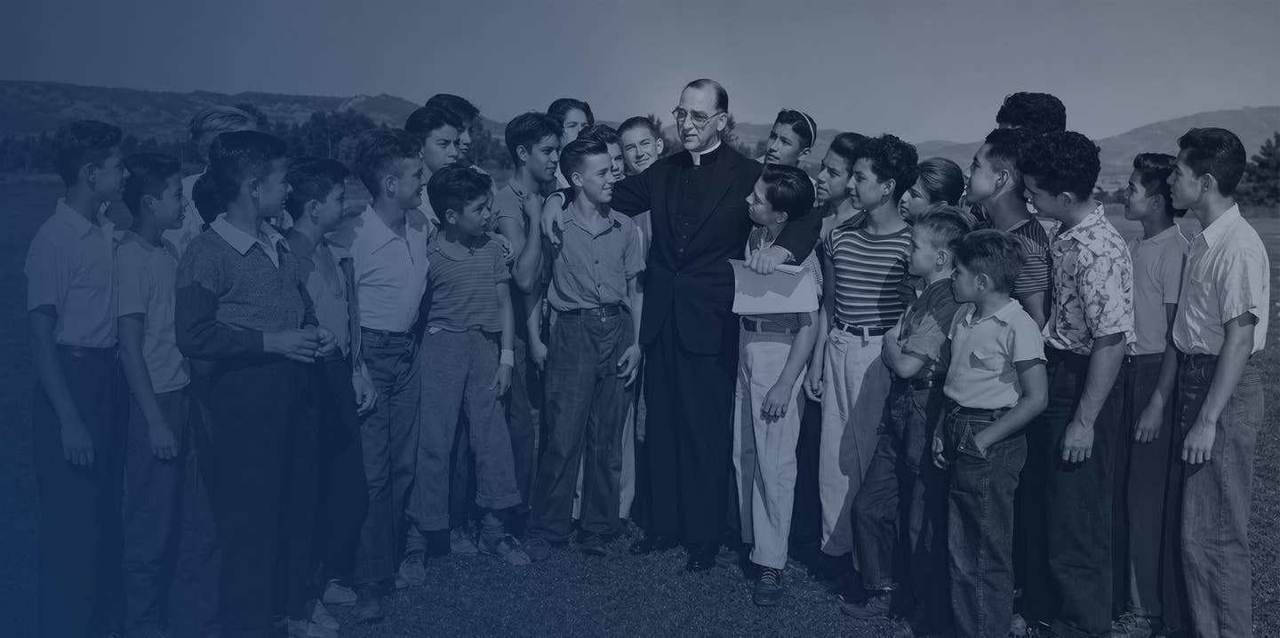 Father Flanagan with a group of children