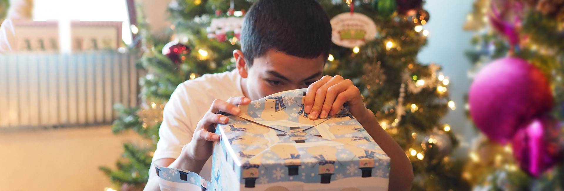 boy opening christmas present