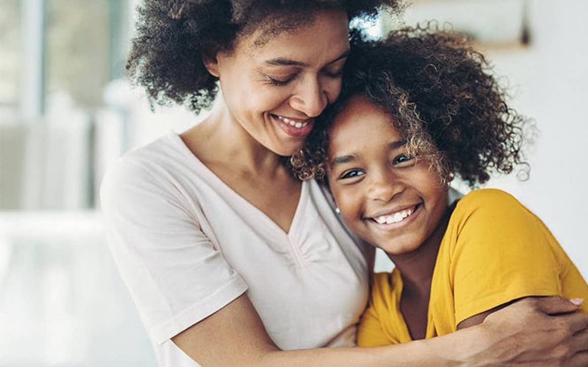 Mother hugging child