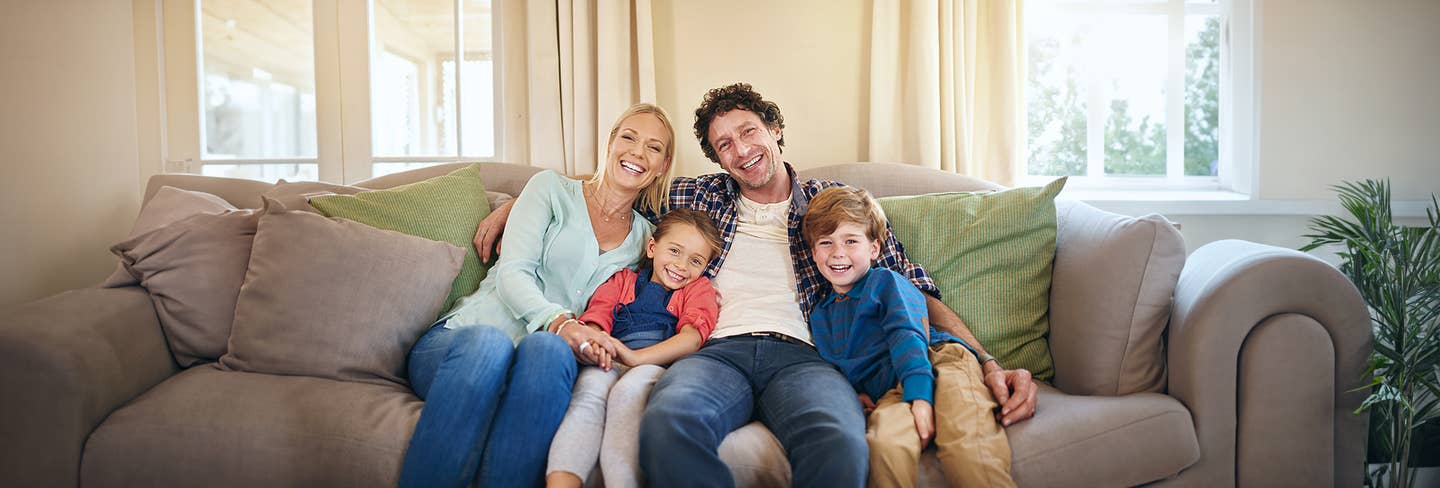 Family sitting on a couch
