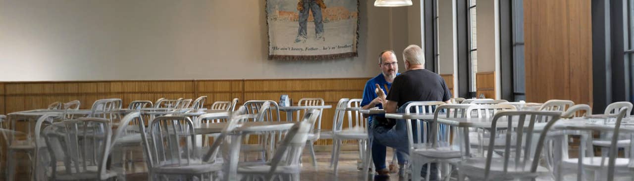 Two men eating lunch together