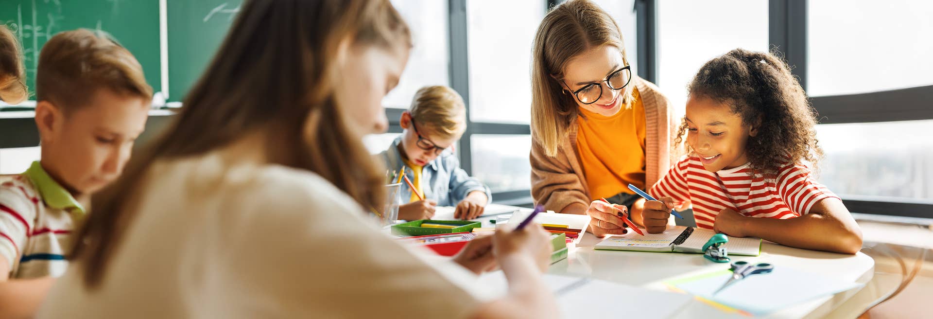Teacher helping student with homework