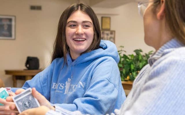 Girl conversing with Assistant Family Teacher