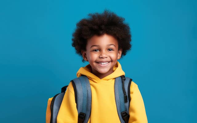 Photo of young boy with backpack