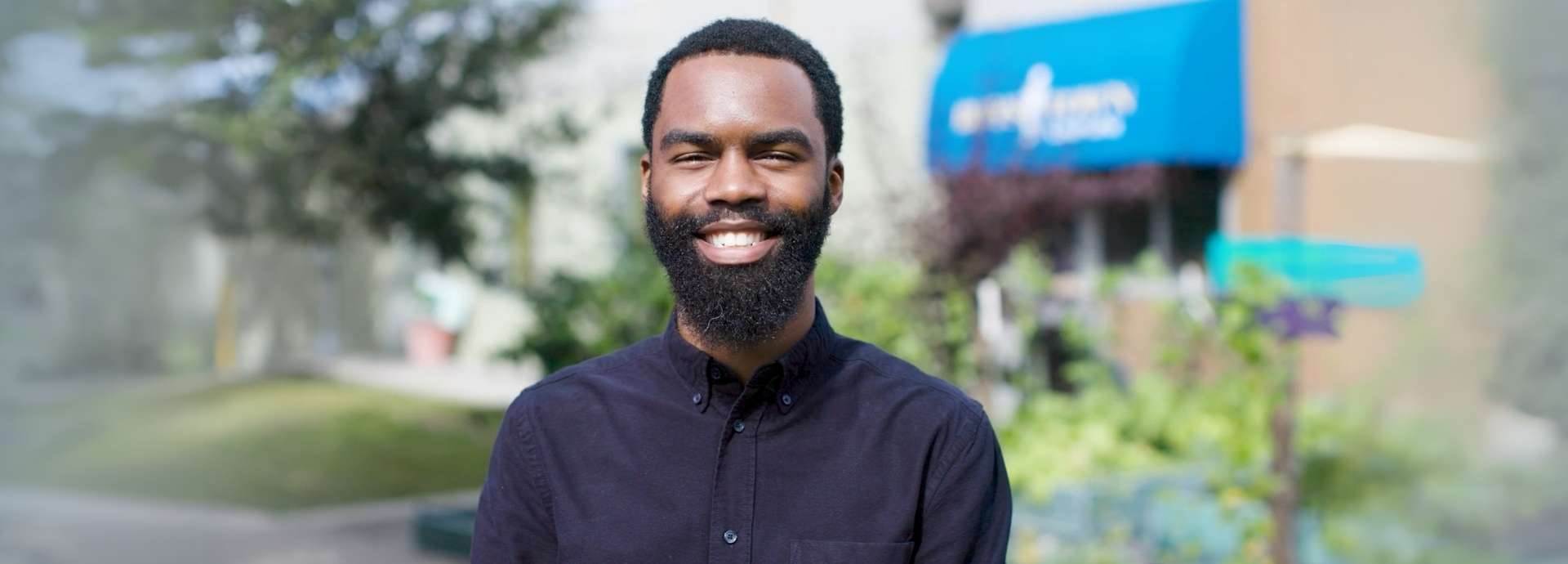 Young man looking at the camera smiling