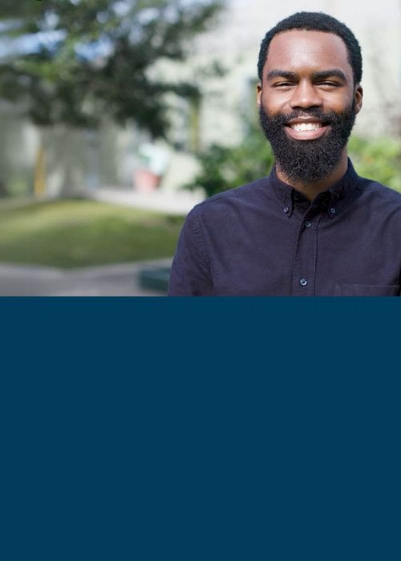 Young man looking at the camera smiling