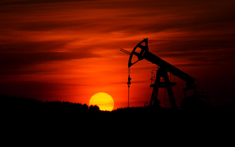 Alberta oil rig, sunset