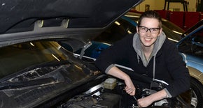 girl working on vehicle