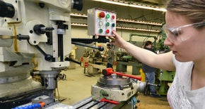 A girl working on a machine