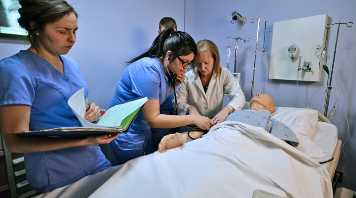 Nurses around a patient