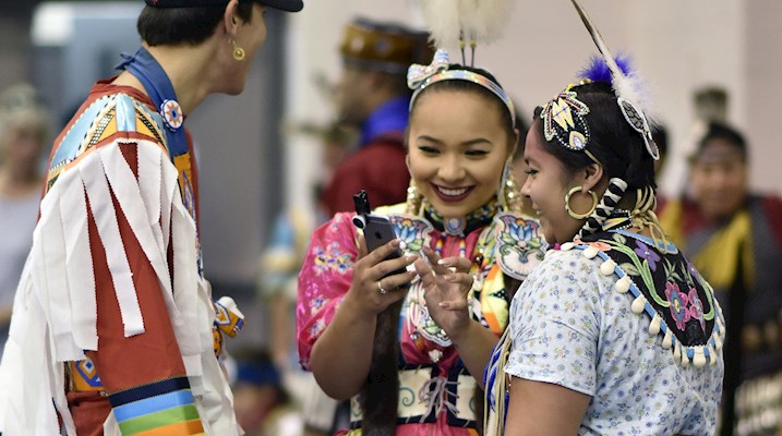Students dressed up at a pow wow