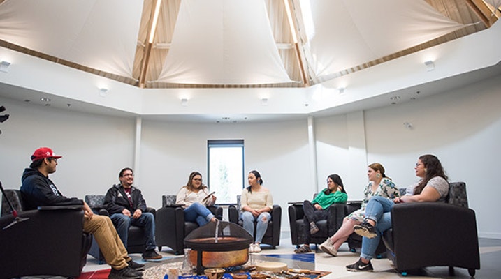 Students sitting in a circle 