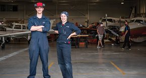 Two students in the hangar