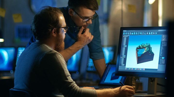 Two guys working on a computer