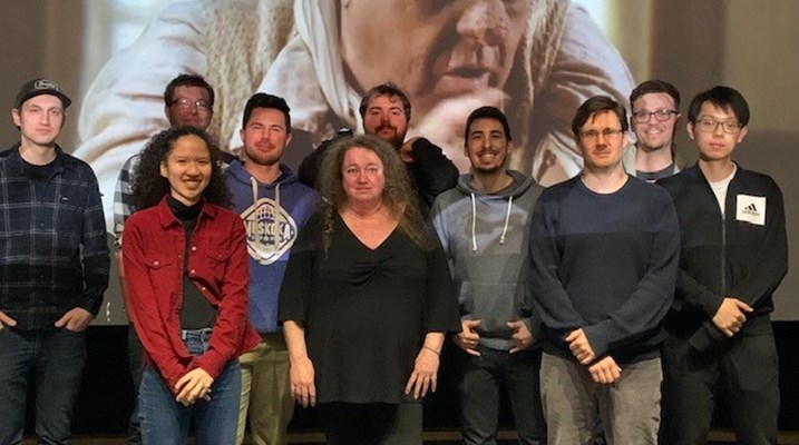 Group of students in front of a screen