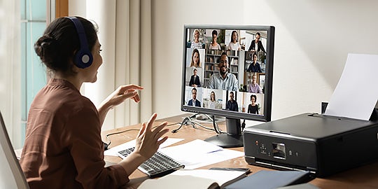 A student attends an online class via video conference