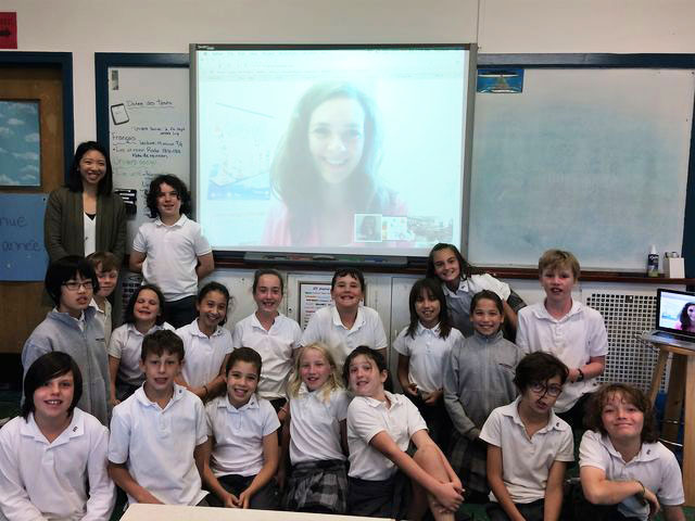 students and pamela yiptong on the white board