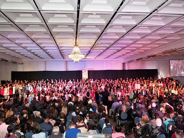 a room with a stage and audience