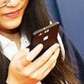 student holding cellphone