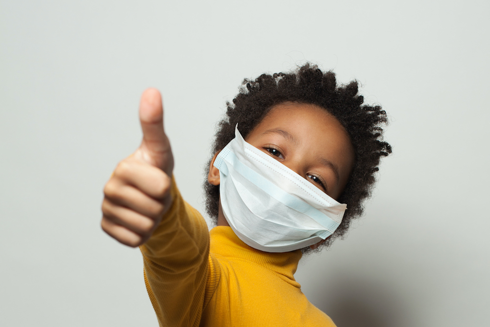 young kid wearing mask