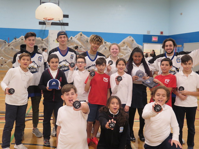 group photo of arctic team with students