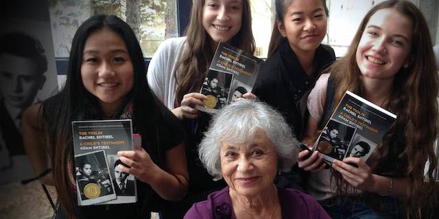 group of people holding books