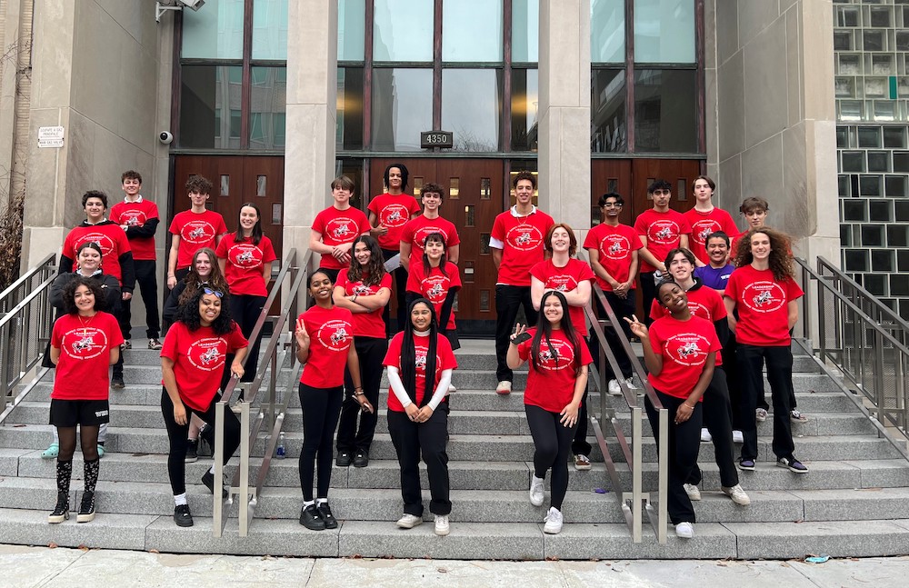 students on the front steps of school