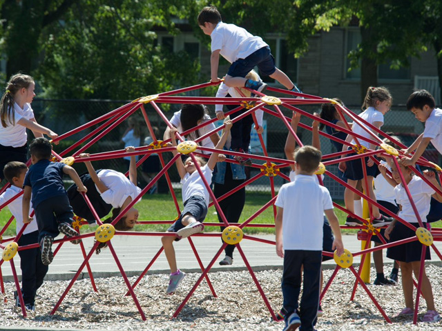 students playing on jungle gym