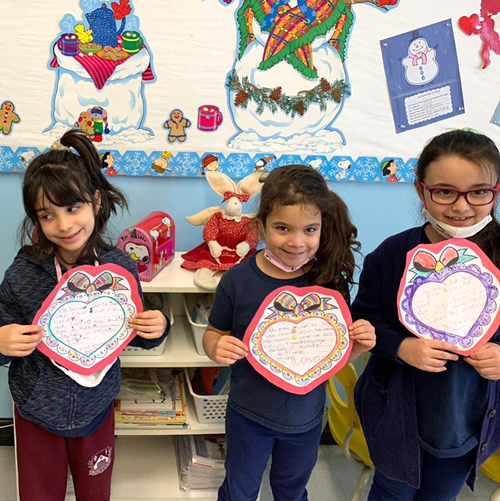 kids holding hearth paper craft