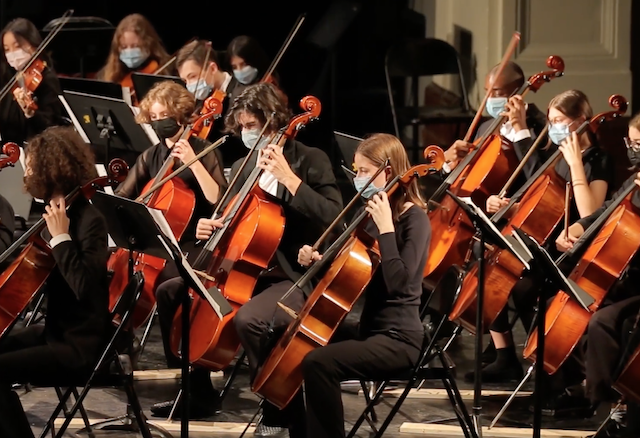 students playing their instruments