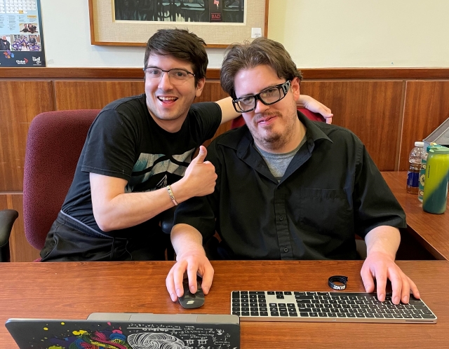 Nathan Stacey, left, and Michael Rivard take a break during their internships for a photo op at the English Montreal School Board on March 14. Photo: Mark Bergman