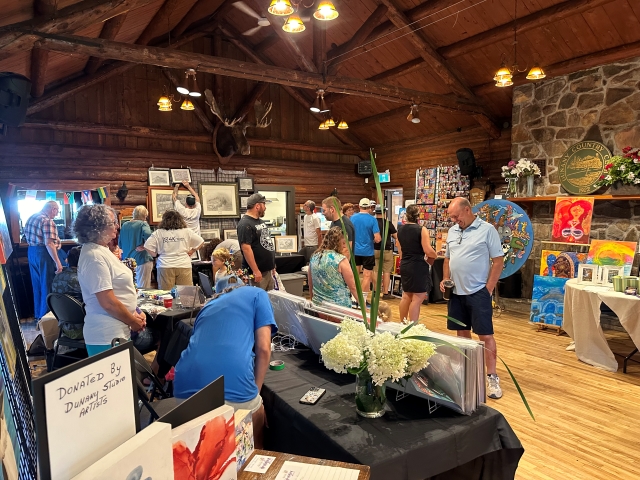 Attendees admire the art donated by Dunany Studio Artists.   Photo courtesy of Jaime Bisaillon     