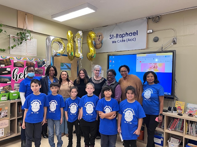 At St. Raphael Elementary School on November 29, 2023, from left, back row: Dr. Léna Moïse, school psychologist; Gail Callender, assistant director of Student Services; Jackie Alvarado and Cindy Mendez, both behaviour management specialists; Michelle Aubin, former educational consultant; Kathy Roach, community worker; Jasmin Skerritt, behaviour management specialist; and principal Joe Anne Désir. Front row: Grade 4 students.    Photo courtesy of St. Raphael Elementary School 