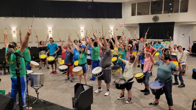 Trouve ta voie participants enjoy a drumming workshop in July 2023 with the Zuruba Afro-Brazilian percussion troupe. Photo: Josiane Beauchamp