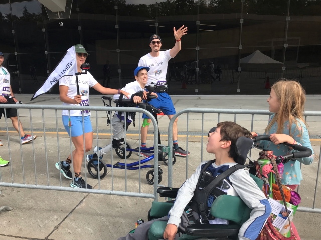 Bradley Heaven, middle, and Dan O’Connor, right, crossed the finish line of the 2022 Montreal Marathon on September 25, 2022.