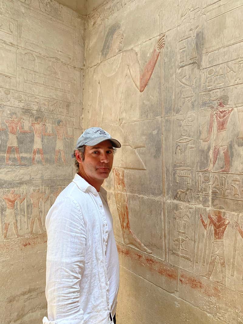 Standing next to wall art thousands of years old