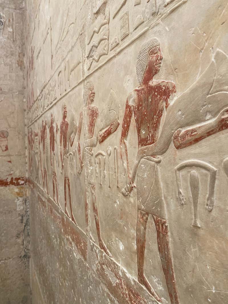 Detailed figures carved and painted into the walls