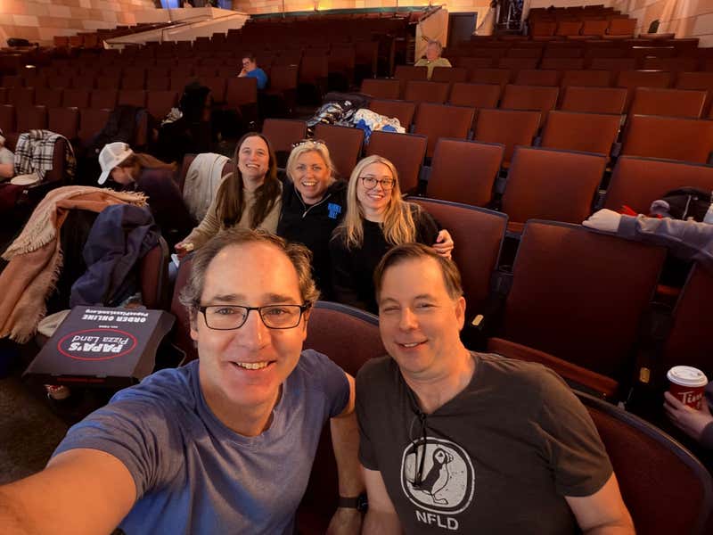 The crew grabbing pizza between setups