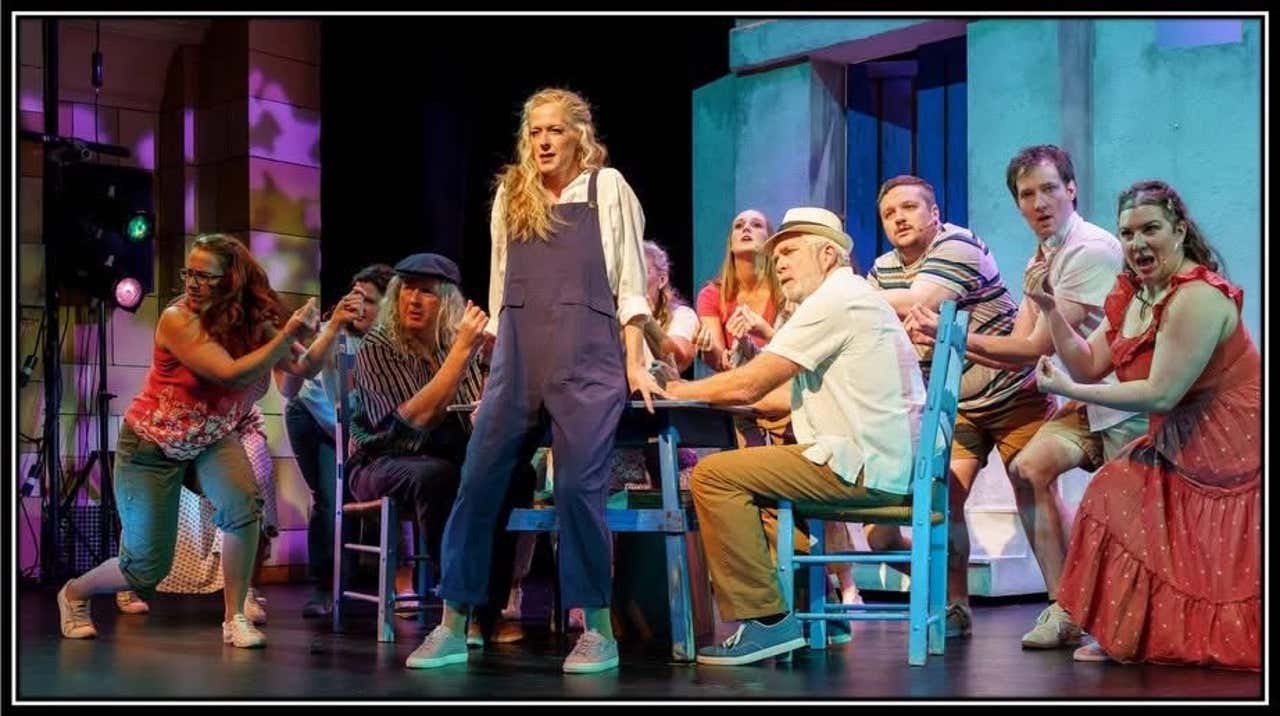 Lisa Heitzner as Donna, standing front and centre with the Mamma Mia ensemble - photo by Sherwood McLernon