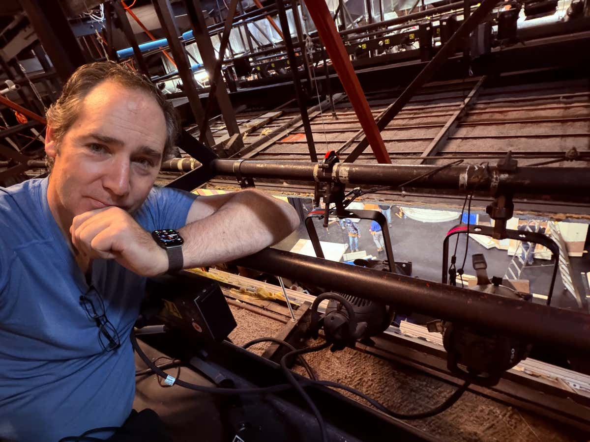 Joel in the lighting grid above the stage at Capitol Theatre during the Mamma Mia hang