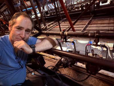 Joel in the lighting grid above the stage at Capitol Theatre during the Mamma Mia hang
