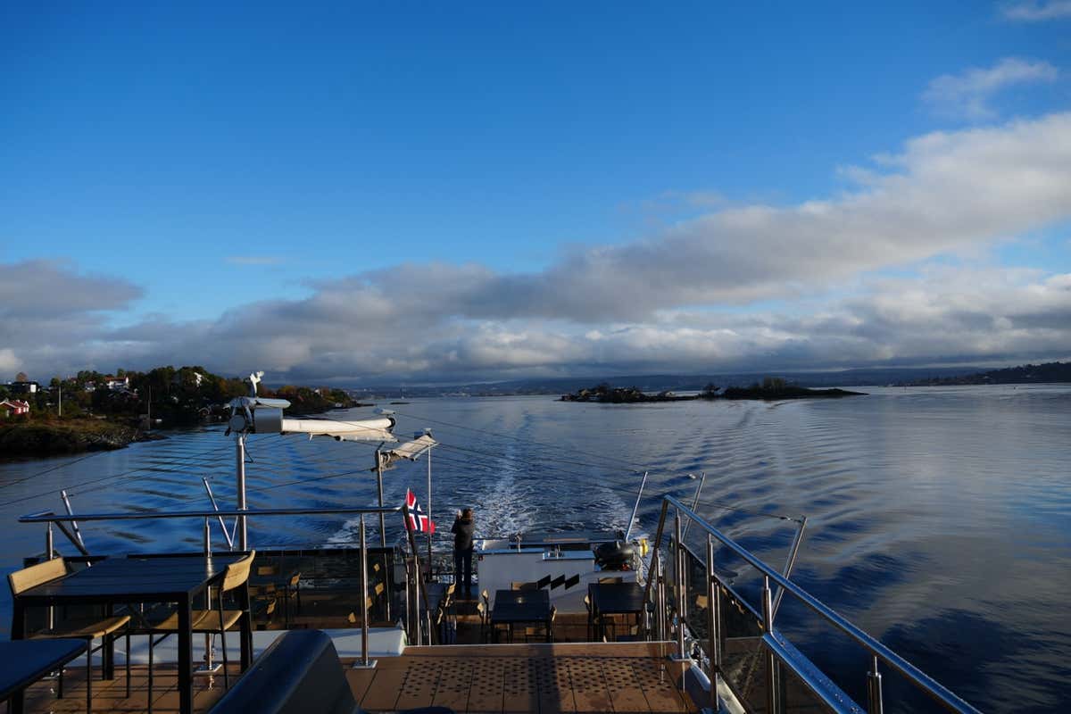 Ferry ride through the Oslo Fjord with Norwegian flag