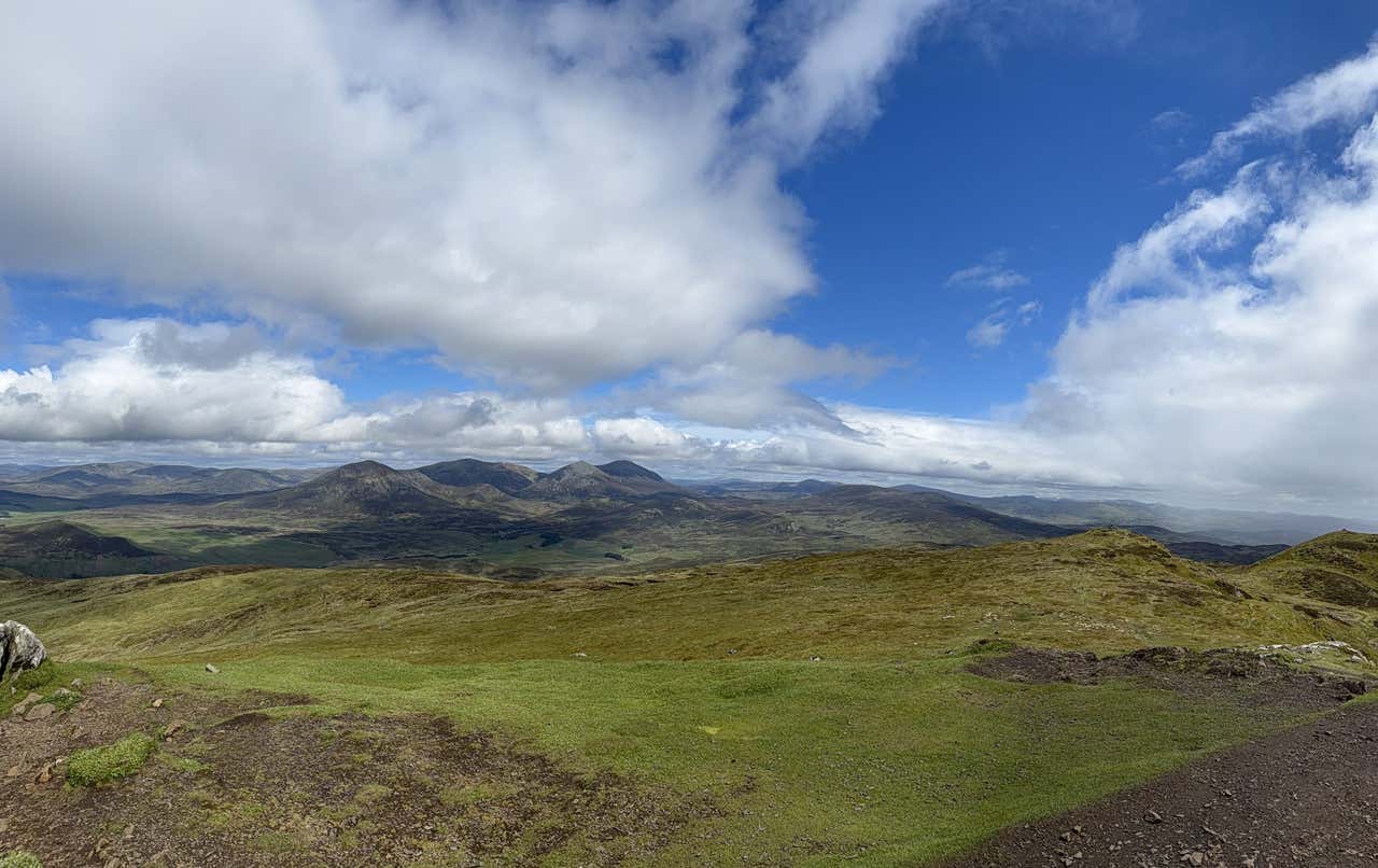 The summit moment on Ben Vrackie, sun bursting through for a full 360 degree view of Highland Perthshire