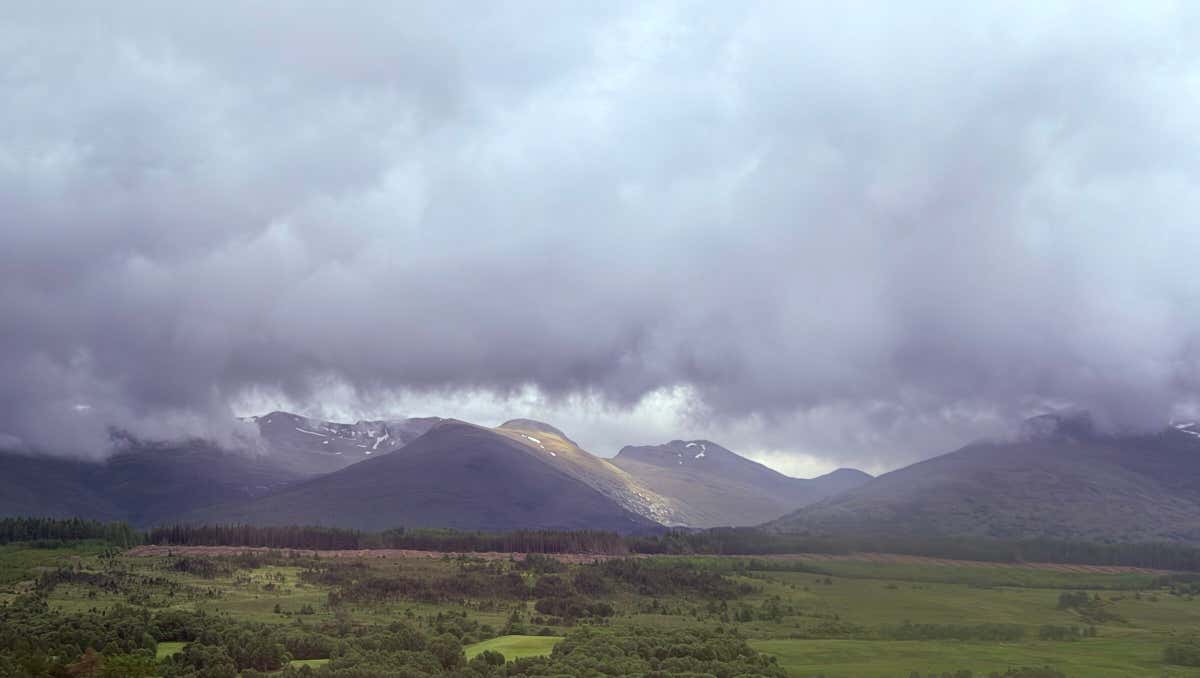 A break in the clouds dropping a beam of light on the hills as we drove