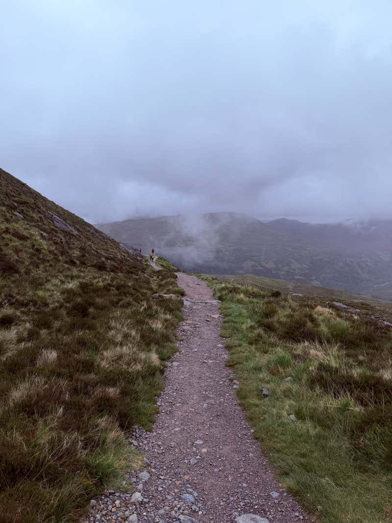 The trail running on with the distance still locked in cloud